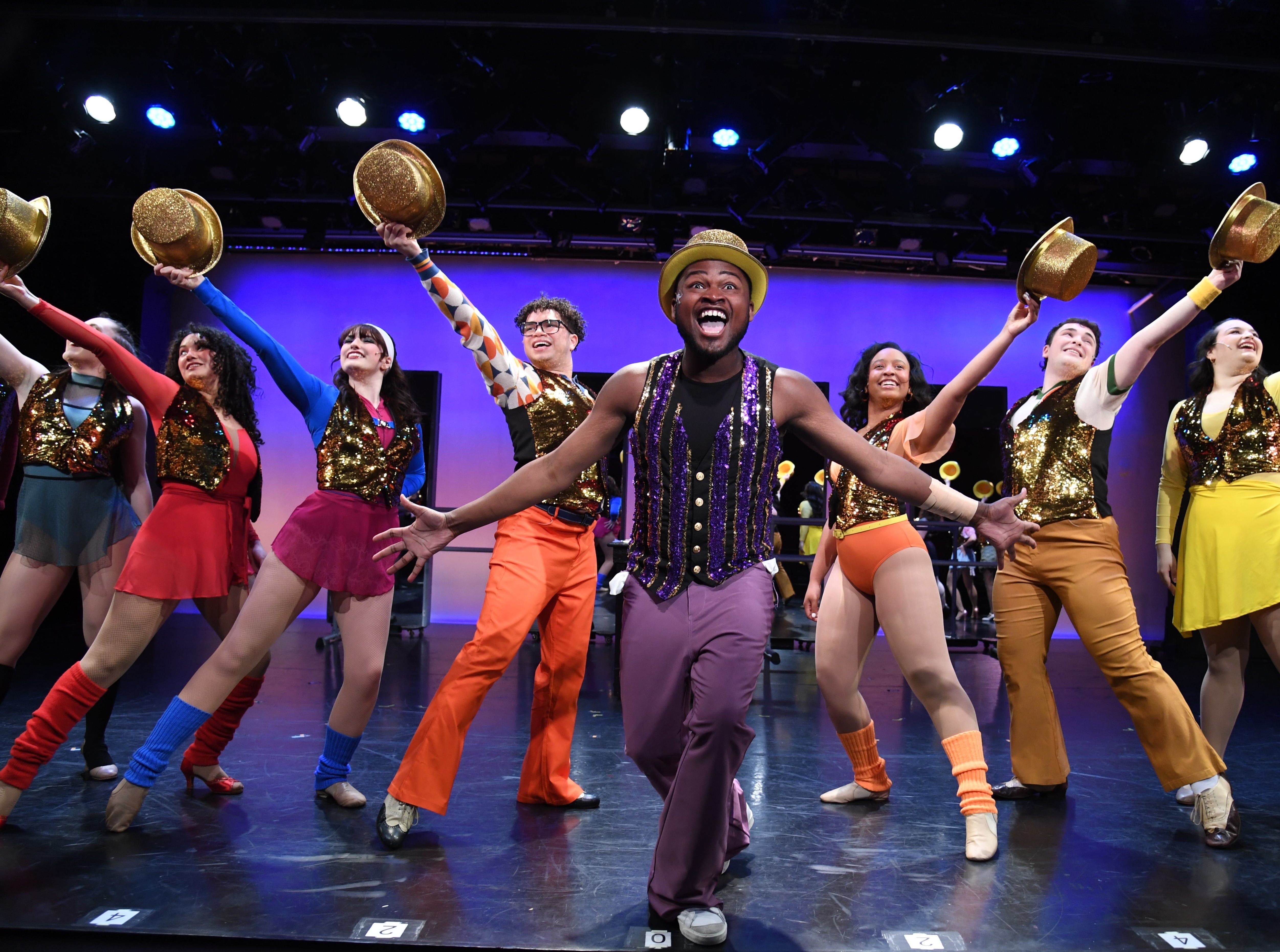 Actors performing a group number