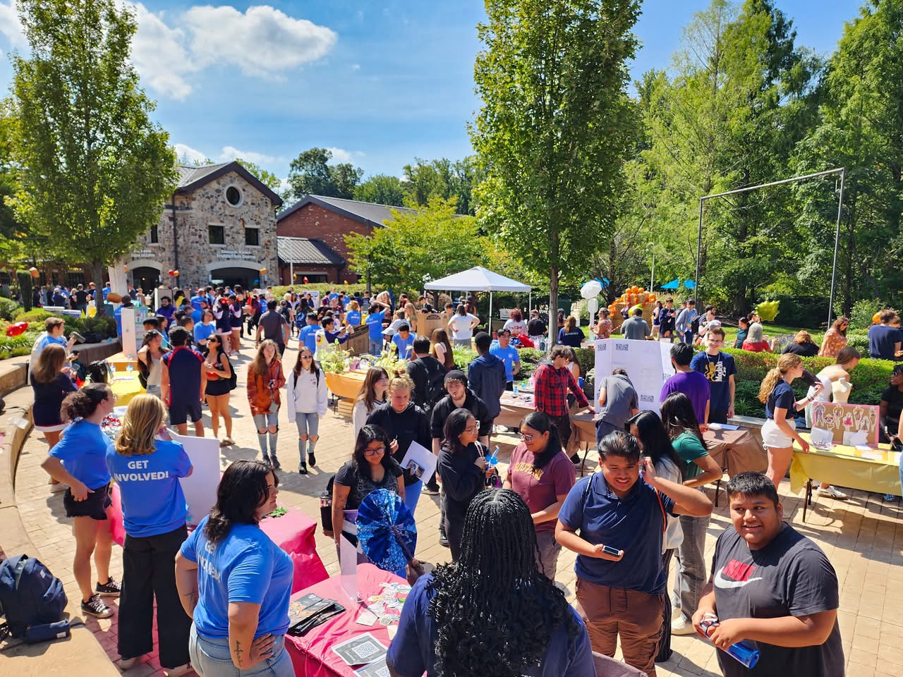 Crowd of students at event to sign-up for clubs. Event outside and across from the Student Life Center