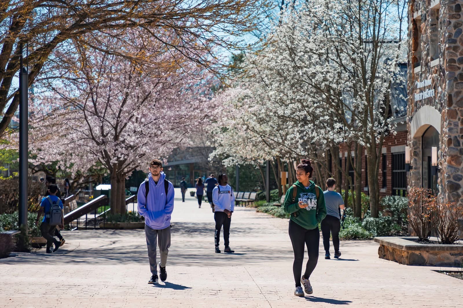 Students walking by the Student Life Center on the Lincroft campus