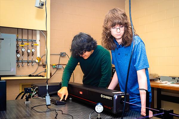 Students practicing with lasers 