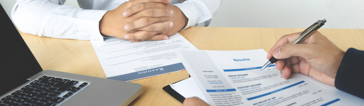Two People Reviewing Resumes Interview Session