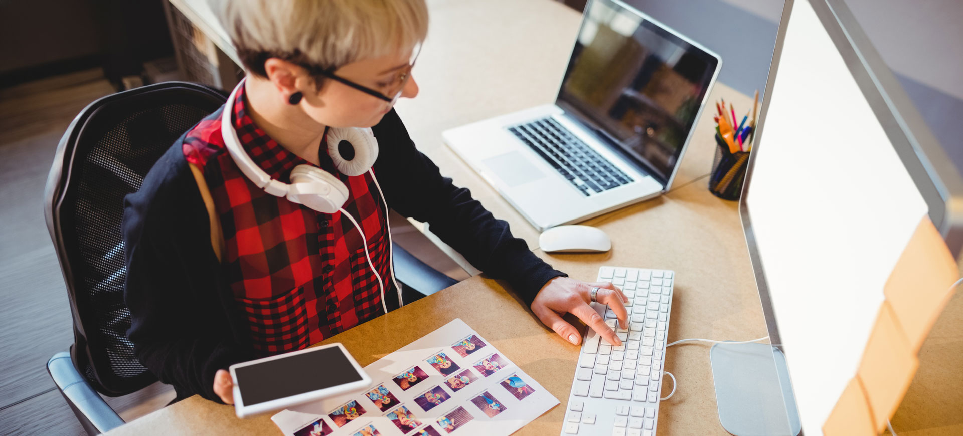 Woman working on computer working with digital content