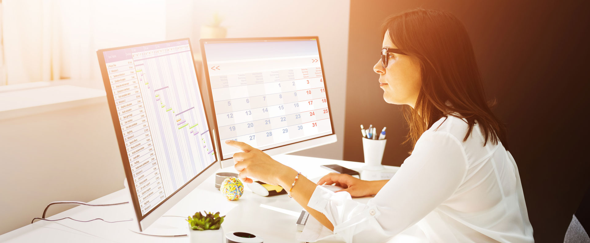Woman working on computer designing social media content