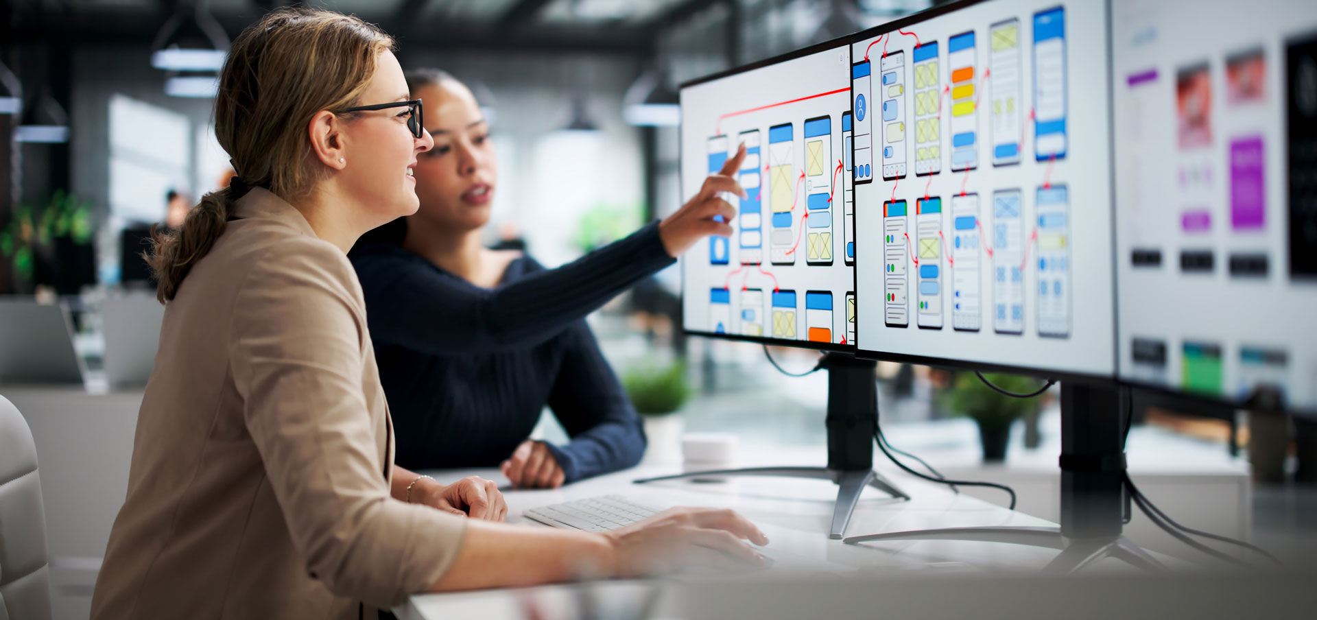 Two people collaborating on design for the web