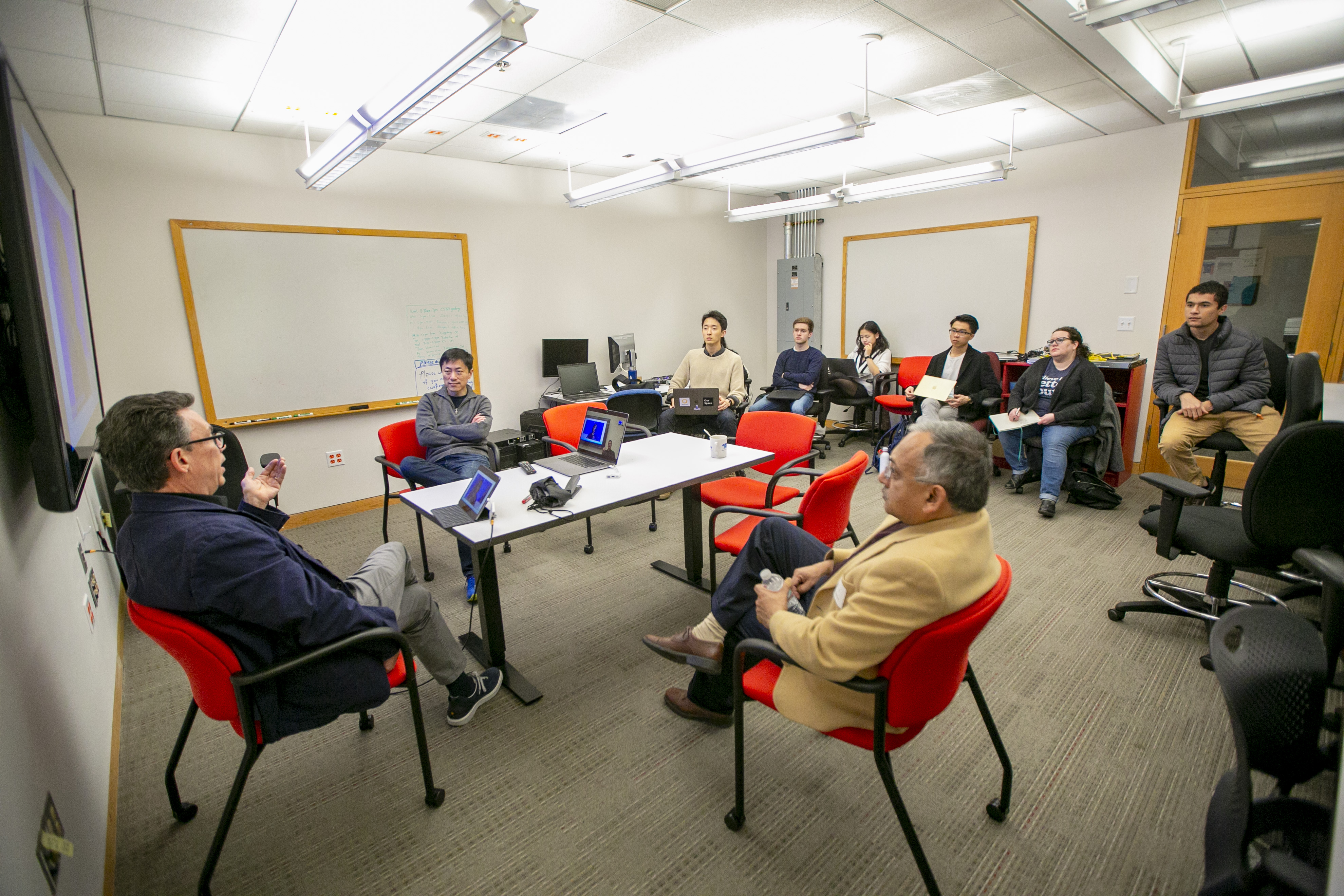 William Adair, left, a professor with the Sanford School of Public Policy-Dewitt Wallace Center for Media and Democracy and Jun Yang, center, professor and associate chair in computer science, and Pankaj Agarwal, left, professor and chair in computer science, meet with students from the Bass Connections Data and Technology for Fact-checking team. The interdisciplinary team project seeks to leverage the power of data and computing to help make fact-checking and dissemination of fact-checks to the public more effective, scalable and sustainable.