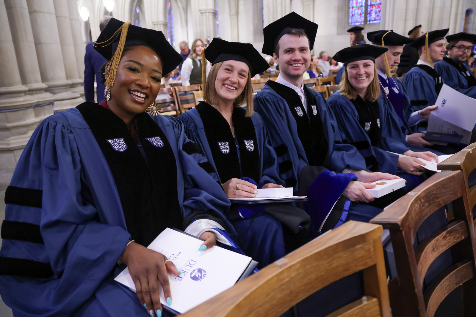 Students celebrate at the 2025 Ph.D. hooding ceremony.