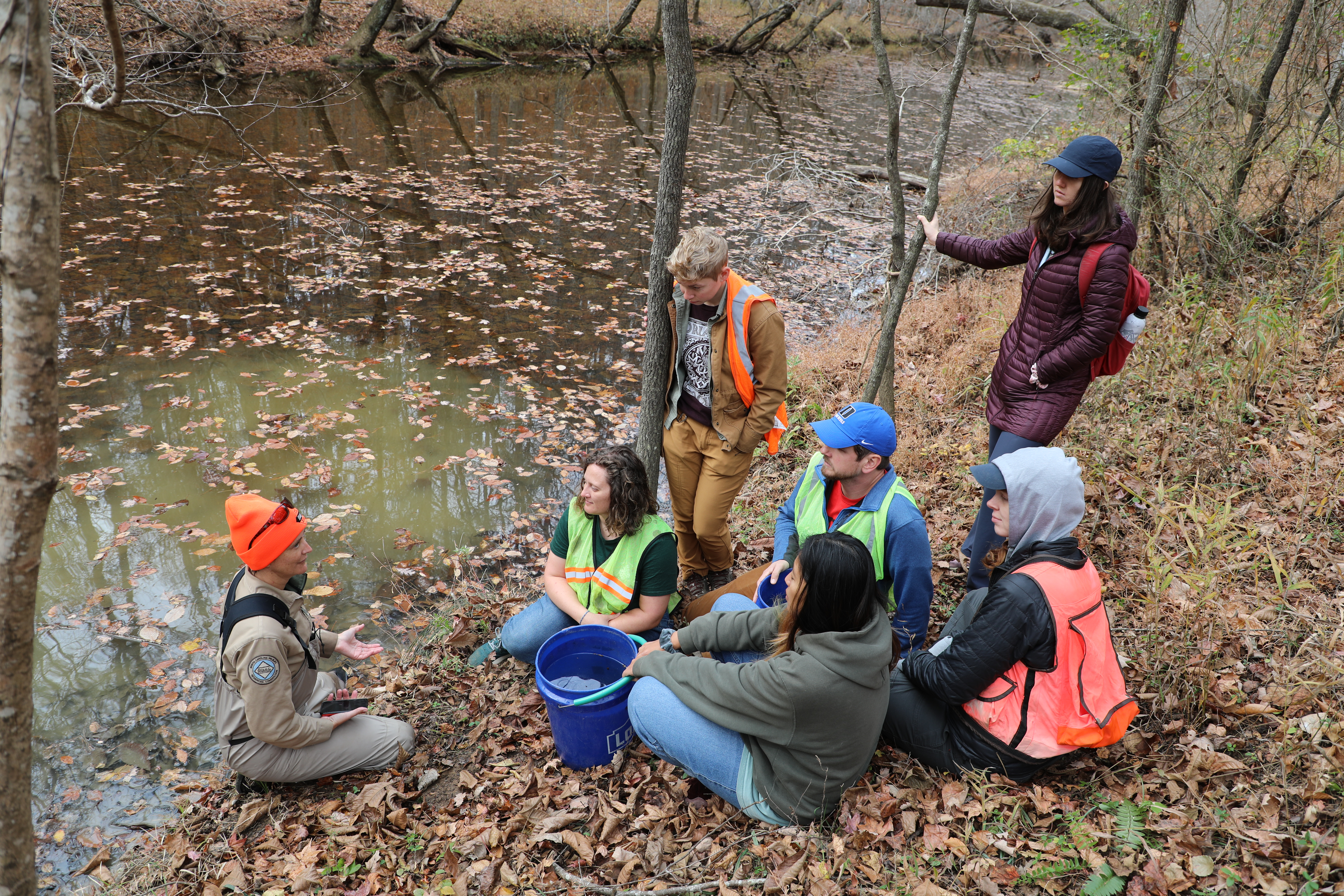 A group gathers in Duke Forest.