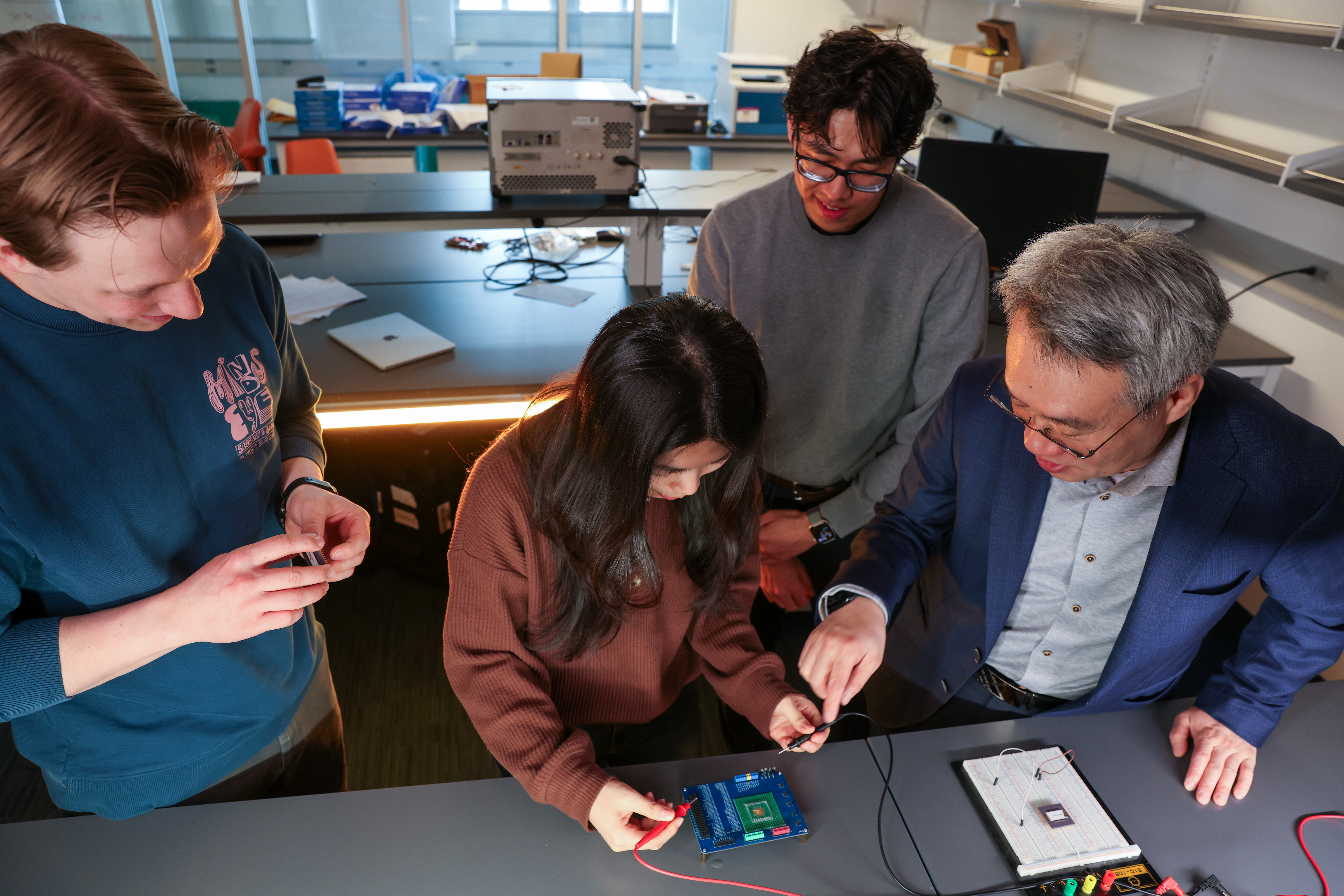 Professor Yiran Chen instructs three students on research focused on innovations in emerging memory and storage systems, machine learning and neuromorphic computing, and edge computing. 