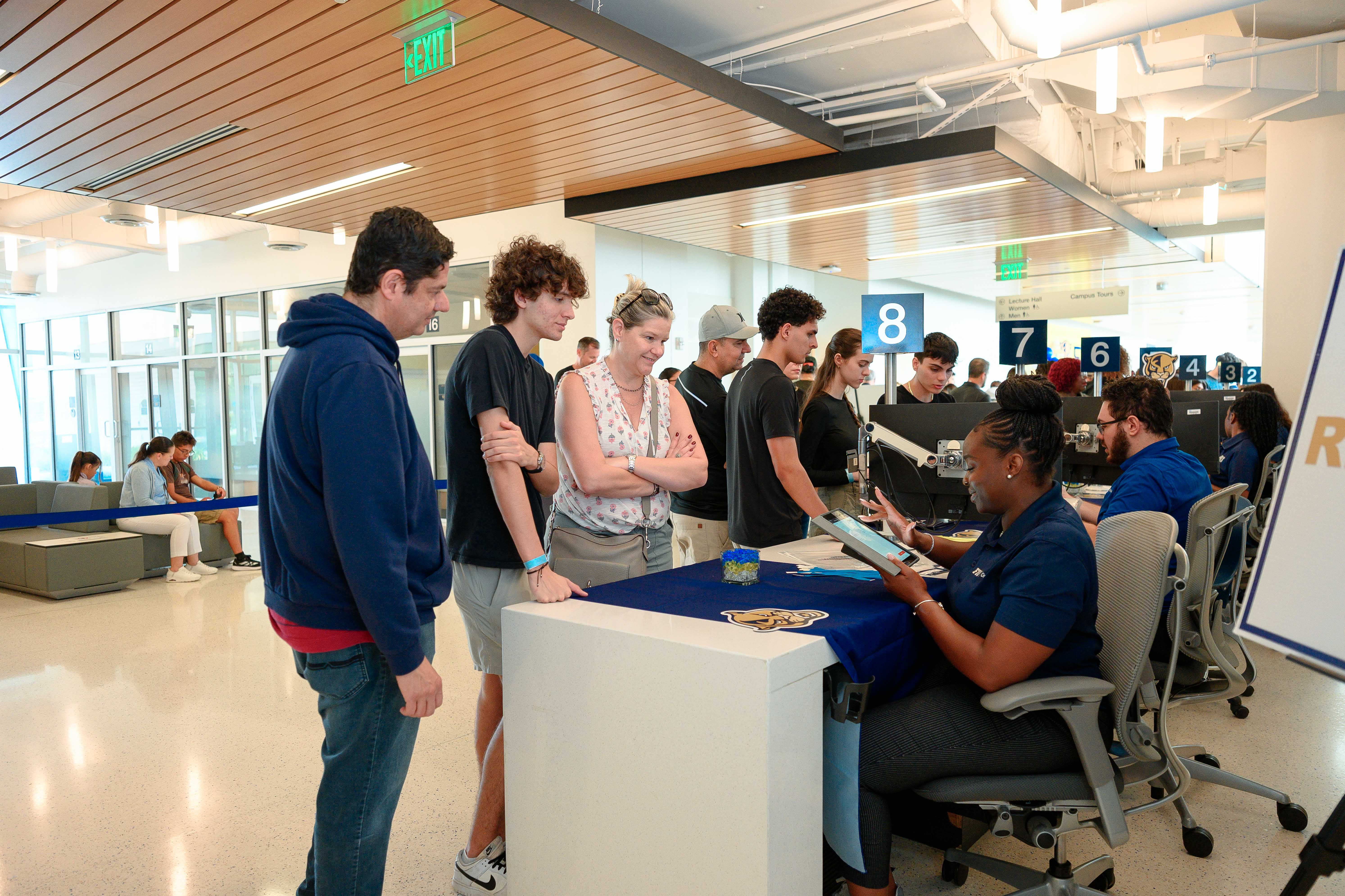 Students and parents in front of the FIU OneStop counter on FIU Admitted Students Day 2026.