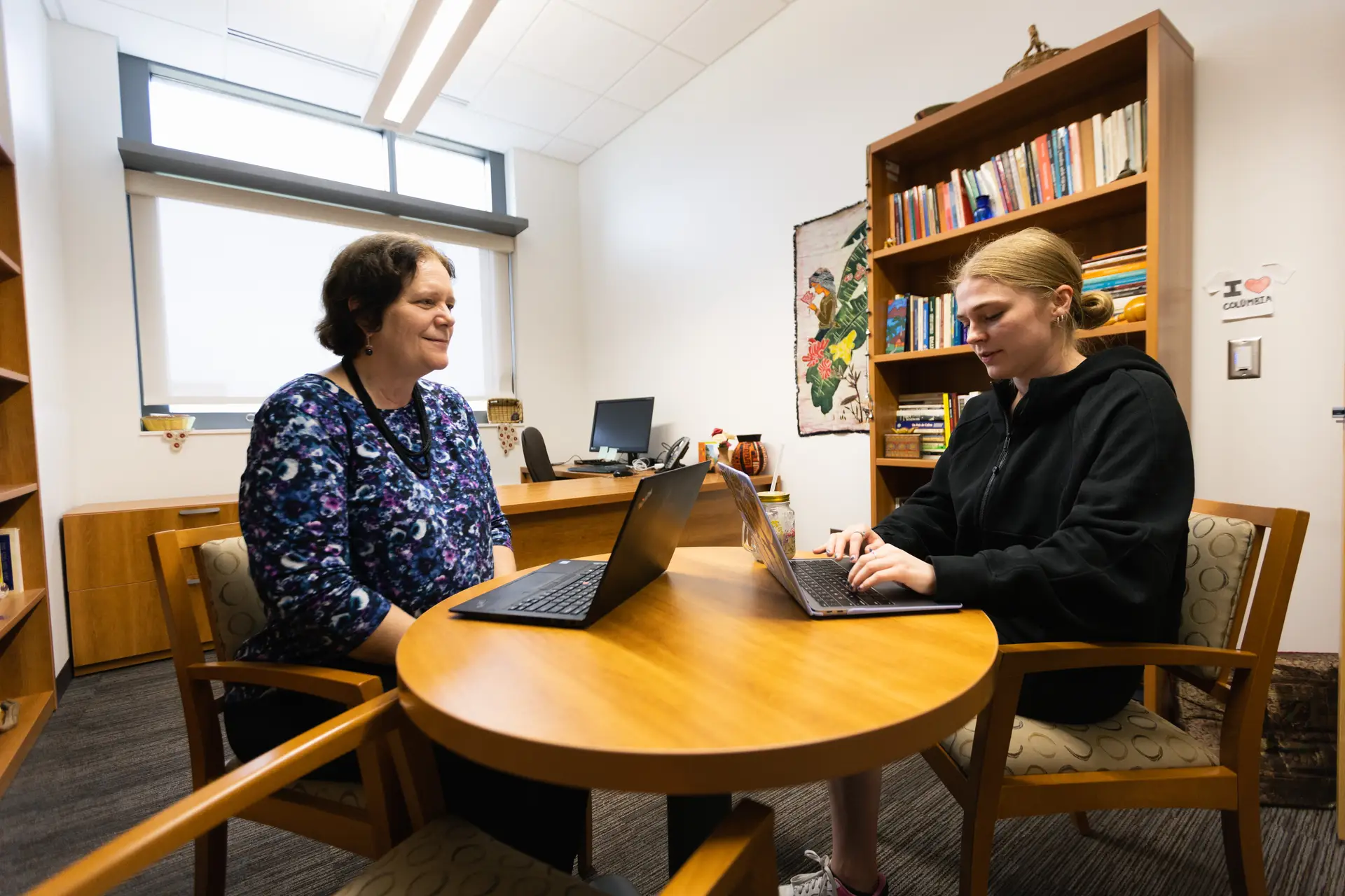 Faculty working with student