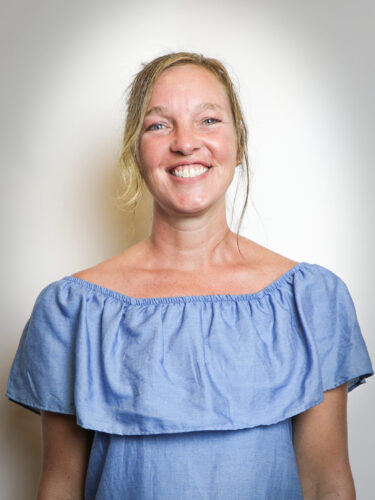 Woman in blue dress with blonde hair