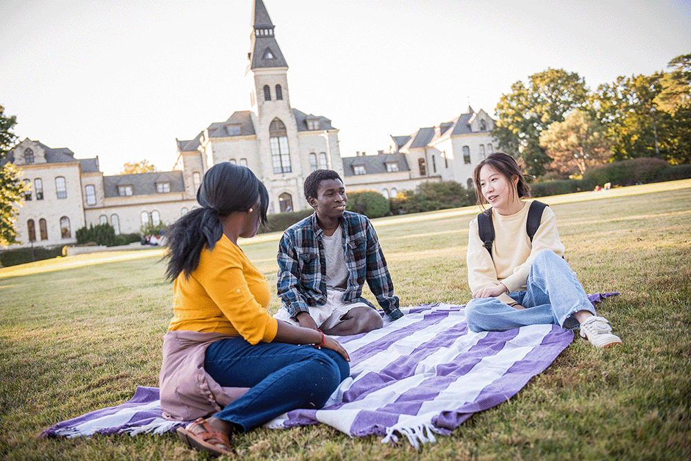3 students on Anderson Lawn