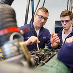 Cadets throwing hats in the air
