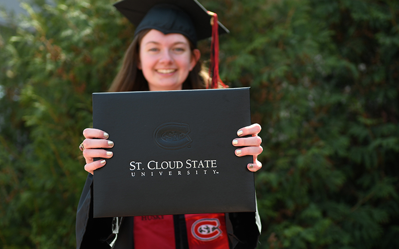 Graduate with diploma