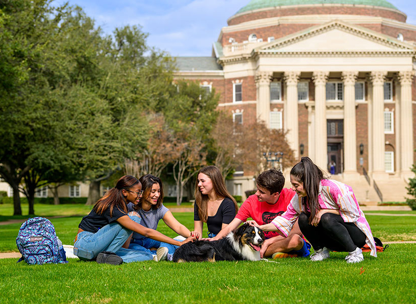 SMU students sitting on quad
