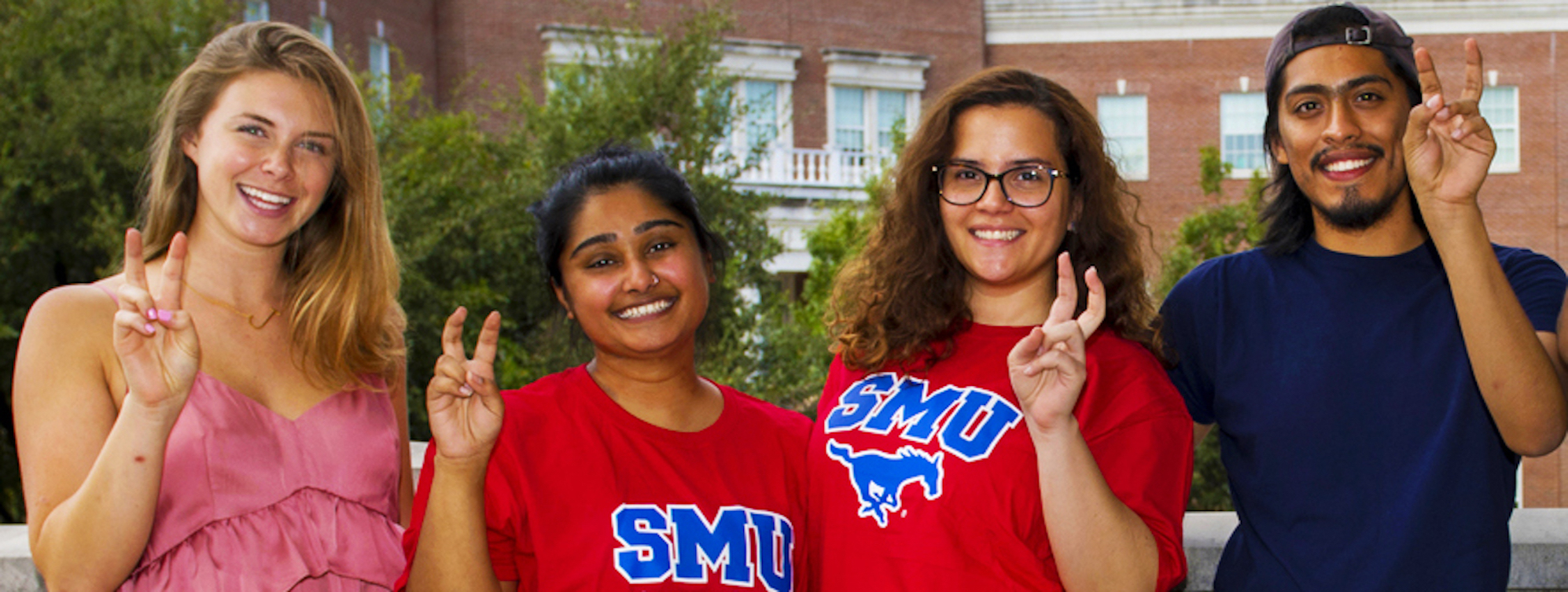 Group of Transfer Students doing the Pony Up hand sign