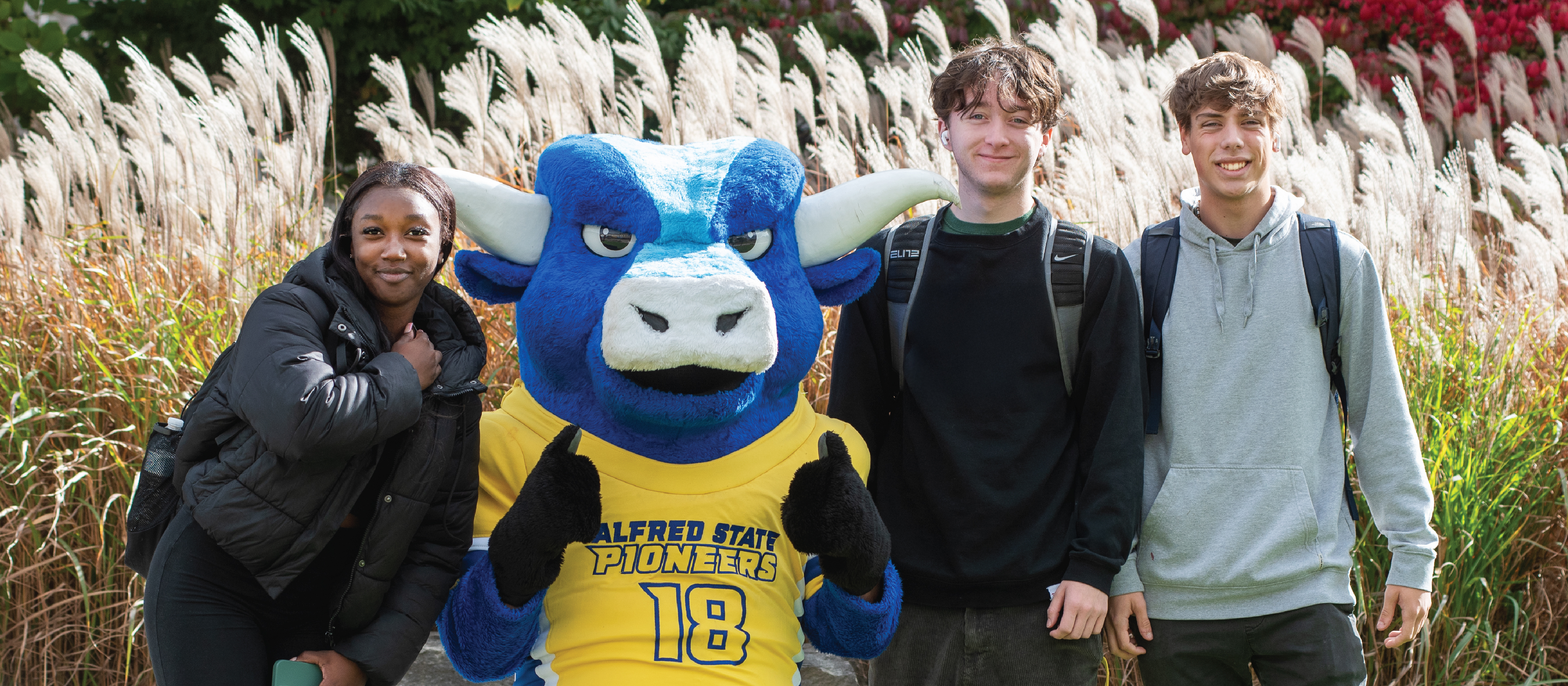 Alfred State College's mascot, Big Blue, with students