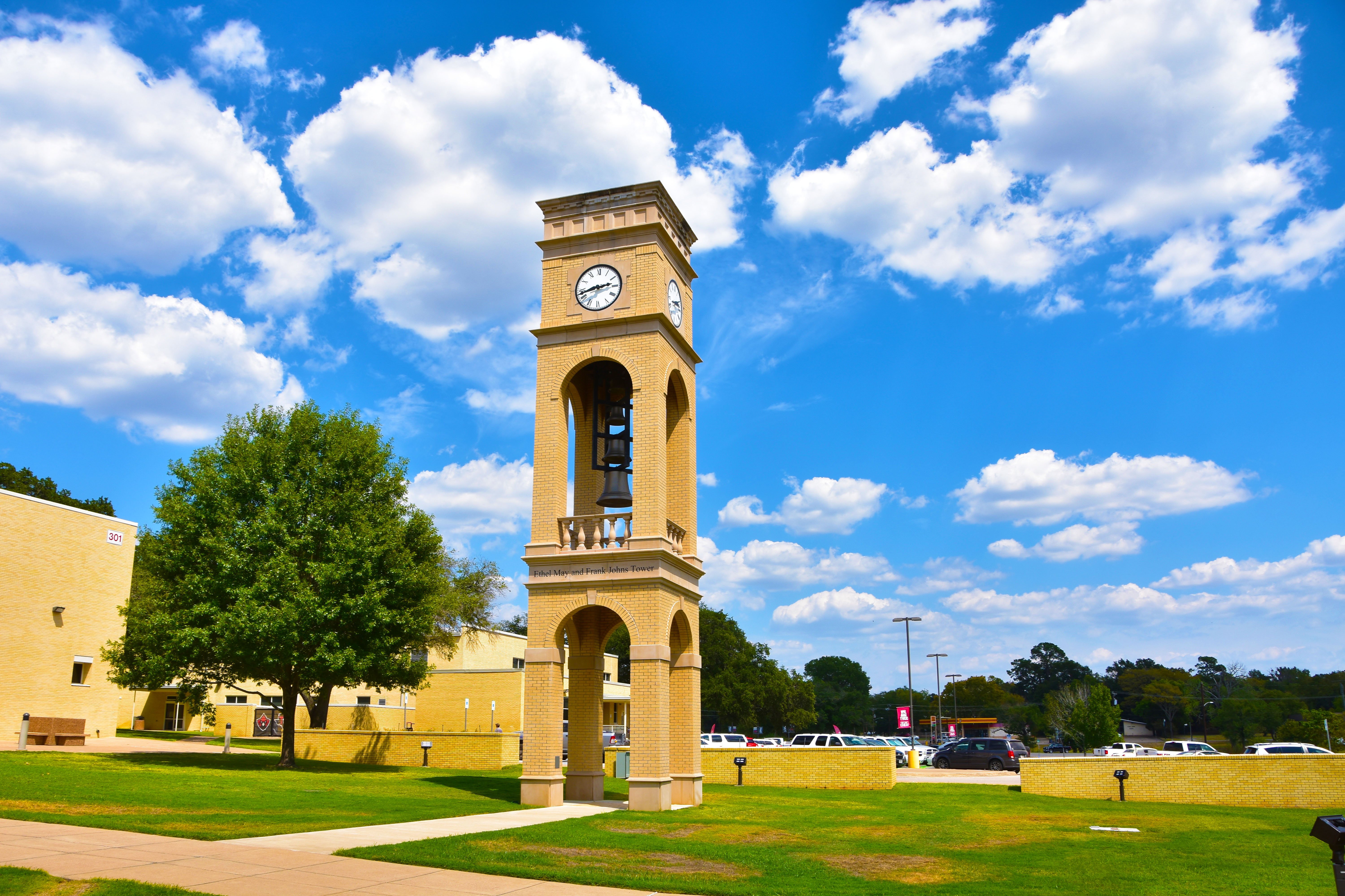 Brick clock tower with blue sky and clouds in TVCC court yard.