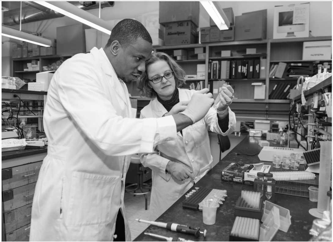 QNS Image of Student & Professor in Laboratory